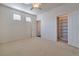 Spacious bedroom with ceiling fan and closet at 4880 Da Vinci Way, Pahrump, NV 89061