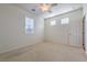 Well-lit bedroom with ceiling fan and window at 4880 Da Vinci Way, Pahrump, NV 89061