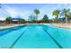 Large lap pool with plenty of lounge chairs at 4880 Da Vinci Way, Pahrump, NV 89061