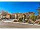 Single-story home with stone accents and two-car garage at 4880 Da Vinci Way, Pahrump, NV 89061