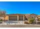 Single-story house with two-car garage and desert landscaping at 4880 Da Vinci Way, Pahrump, NV 89061