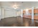 Open living room with hardwood floors and built-in cabinetry at 4880 Da Vinci Way, Pahrump, NV 89061