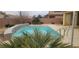 Refreshing pool with a water feature and ample patio space at 4880 Da Vinci Way, Pahrump, NV 89061