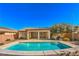 Relaxing backyard oasis featuring a large, inviting pool at 4880 Da Vinci Way, Pahrump, NV 89061