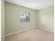 Simple bedroom with light green walls and neutral carpet at 5265 Child Ct # 110, Las Vegas, NV 89103