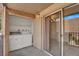 A convenient balcony equipped with laundry machines and a sliding glass door at 5493 Indian River Dr # 383, Las Vegas, NV 89103