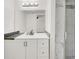 Bathroom features a modern vanity, sleek countertop, framed mirror, and beautiful shower with marble-style tiles at 5493 Indian River Dr # 383, Las Vegas, NV 89103