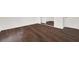 Bright bedroom with dark hardwood floors and mirrored closet doors at 5493 Indian River Dr # 383, Las Vegas, NV 89103