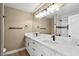 Modern bathroom with double vanity and marble countertops at 6413 Peppermill Dr, Las Vegas, NV 89146