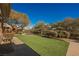 Landscaped backyard with artificial turf and trampoline at 646 Saint Croix St, Henderson, NV 89012