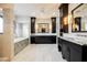 Large bathroom with double vanity and soaking tub at 646 Saint Croix St, Henderson, NV 89012