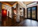 Bright entry hall showcasing stone pillars and hardwood floors at 646 Saint Croix St, Henderson, NV 89012