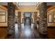 Two-story entryway with stone pillars and a grand staircase at 646 Saint Croix St, Henderson, NV 89012