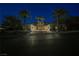 Beautiful home exterior featuring mature landscaping, a circular driveway, and a grand entrance at 646 Saint Croix St, Henderson, NV 89012