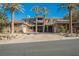 Two-story luxury home with stone accents and palm trees at 646 Saint Croix St, Henderson, NV 89012