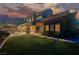 Beautiful two-story home with lush green lawn, stone accents, and manicured landscaping at 646 Saint Croix St, Henderson, NV 89012