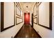 Long hallway with dark hardwood floors and decorative wall at 646 Saint Croix St, Henderson, NV 89012