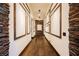 Elegant hallway with stone accents and hardwood floors at 646 Saint Croix St, Henderson, NV 89012