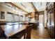 Open kitchen with a large wooden table and a large island at 646 Saint Croix St, Henderson, NV 89012