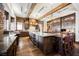 Spacious kitchen with large island, dark wood cabinets, and granite counters at 646 Saint Croix St, Henderson, NV 89012