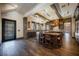 Gourmet kitchen boasts dark wood cabinetry, granite counters, and large island at 646 Saint Croix St, Henderson, NV 89012