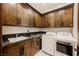 Laundry room with washer, dryer, and ample storage at 646 Saint Croix St, Henderson, NV 89012