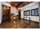 Cozy library with a fireplace, built-in shelves, and hardwood floors at 646 Saint Croix St, Henderson, NV 89012