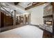 Large living room with a stone fireplace and hardwood floors at 646 Saint Croix St, Henderson, NV 89012