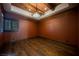 Spacious office with dark wood floors and rich walls at 646 Saint Croix St, Henderson, NV 89012