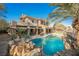 Luxury pool and spa with outdoor kitchen and patio at 646 Saint Croix St, Henderson, NV 89012
