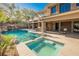 Expansive pool, spa, and outdoor kitchen area at 646 Saint Croix St, Henderson, NV 89012