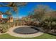 Circular trampoline in a landscaped backyard at 646 Saint Croix St, Henderson, NV 89012