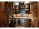 Custom wine cellar with stone and wood finishes at 646 Saint Croix St, Henderson, NV 89012