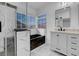 Beautiful bathroom featuring glass enclosed shower, tub, and vanity at 6586 W Mesa Vista Ave, Las Vegas, NV 89118