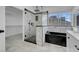Bathroom featuring glass enclosed shower, tub, and white marble vanity at 6586 W Mesa Vista Ave, Las Vegas, NV 89118