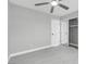 Bedroom features hardwood floors and gray walls, with a sliding closet door and a second entry door at 6586 W Mesa Vista Ave, Las Vegas, NV 89118