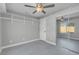 Bright bedroom features mirrored closets, recessed lighting, and built-in shelving at 6586 W Mesa Vista Ave, Las Vegas, NV 89118