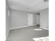 A spacious bedroom features hardwood floors and gray walls, with two entry doors at 6586 W Mesa Vista Ave, Las Vegas, NV 89118