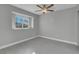 Bright bedroom features hardwood floors, gray walls, and a window with a view to the outside at 6586 W Mesa Vista Ave, Las Vegas, NV 89118