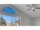 Bright bedroom with a large window and ceiling fan at 6586 W Mesa Vista Ave, Las Vegas, NV 89118