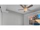Well-lit bedroom with a ceiling fan and view of the backyard swimming pool at 6586 W Mesa Vista Ave, Las Vegas, NV 89118