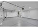 Large garage with built in storage cabinets, epoxy floor, and plenty of room for storage at 6586 W Mesa Vista Ave, Las Vegas, NV 89118