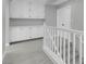 Upstairs hallway featuring extra storage, bright light, and stairway access at 6586 W Mesa Vista Ave, Las Vegas, NV 89118