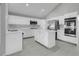Kitchen with white cabinets, stainless appliances, and center island at 6586 W Mesa Vista Ave, Las Vegas, NV 89118