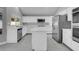 Beautiful kitchen with white cabinets, marble countertops, and stainless steel appliances at 6586 W Mesa Vista Ave, Las Vegas, NV 89118