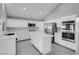Modern kitchen featuring stainless steel appliances and a large center island at 6586 W Mesa Vista Ave, Las Vegas, NV 89118