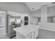 Bright kitchen with stainless steel appliances, marble island, and backyard access at 6586 W Mesa Vista Ave, Las Vegas, NV 89118
