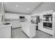 Modern kitchen featuring white cabinets, stainless steel appliances, and a large island at 6586 W Mesa Vista Ave, Las Vegas, NV 89118