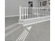 Bright living area featuring wood-look floors and staircase with white banister at 6586 W Mesa Vista Ave, Las Vegas, NV 89118