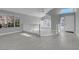 Bright and airy living room featuring vaulted ceiling and large windows at 6586 W Mesa Vista Ave, Las Vegas, NV 89118
